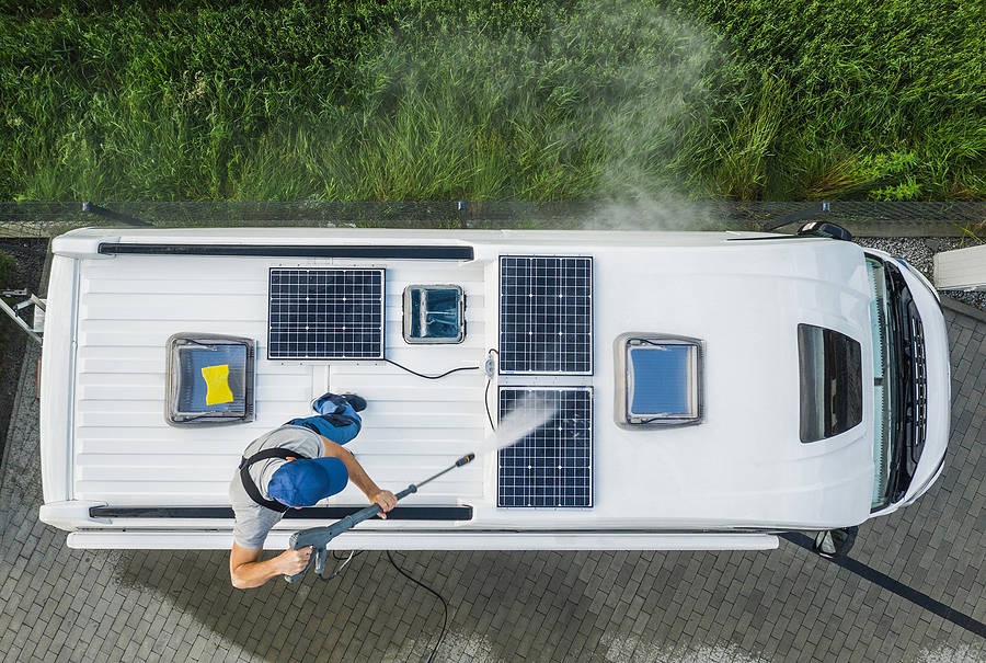 Touring caravan being washed down
