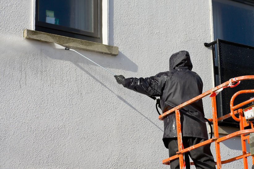 Pressure washing from a cherry picker at height